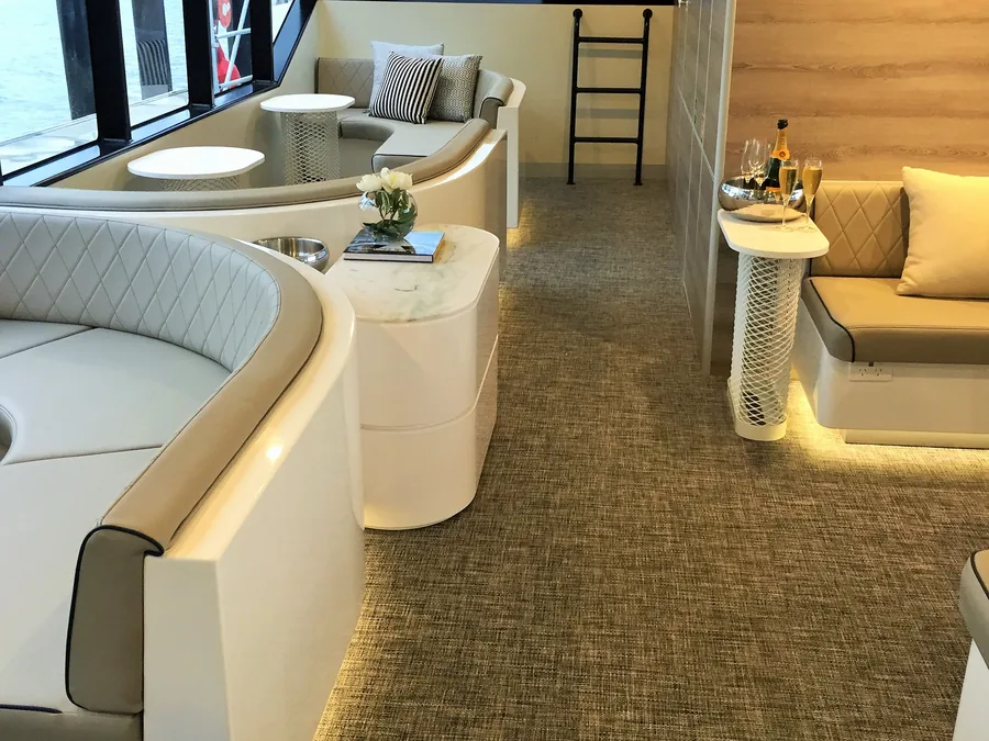 Woven vinyl floor running through the saloon of a motor yacht