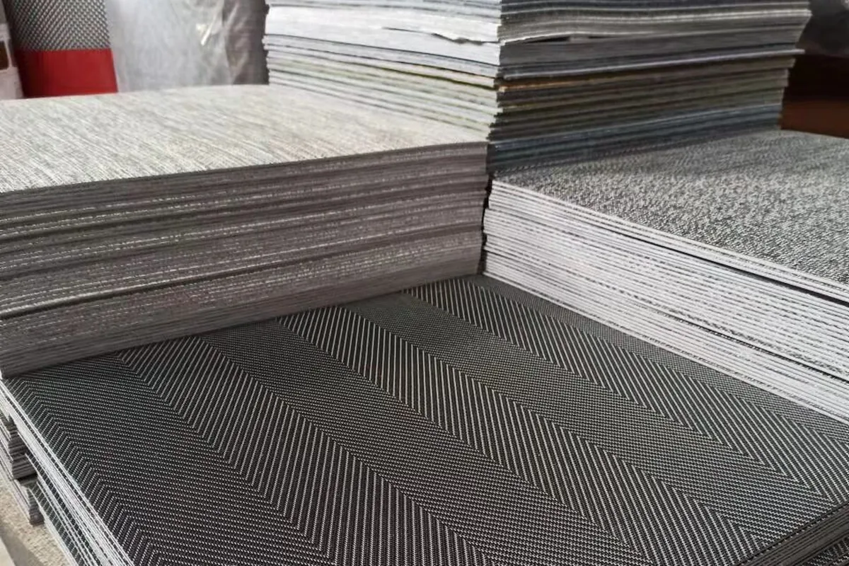 Cut modular tiles stacked and waiting for the cartons at the woven vinyl production base in Zhejiang