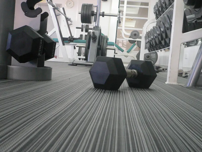 Cardio area on woven vinyl flooring
